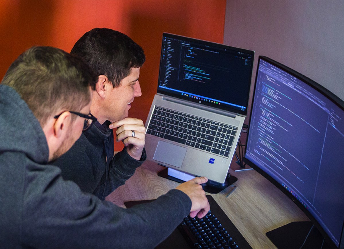 Two DankoSpark developers reviewing code together